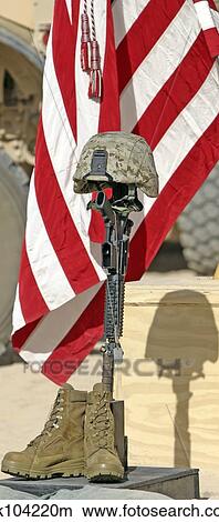 A battlefield memorial cross rifle display. View Large Photo Image Picture - A battlefield memorial cross rifle display.. Fotosearch