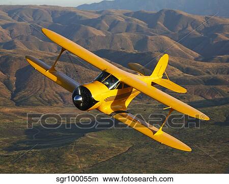 A Beechcraft Model B17R Staggerwing in flight. View Large Photo Image Picture - A Beechcraft Model B17R Staggerwing in flight.. Fotosearch