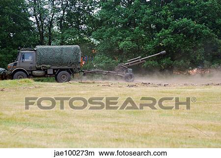 A Belgian artillery unit setting up the LG1 105 mm/30-calibre towed howitzer. View Large Photo Image Picture - A Belgian artillery unit setting up the LG1 105 mm/30-calibre towed howitzer.. Fotosearch