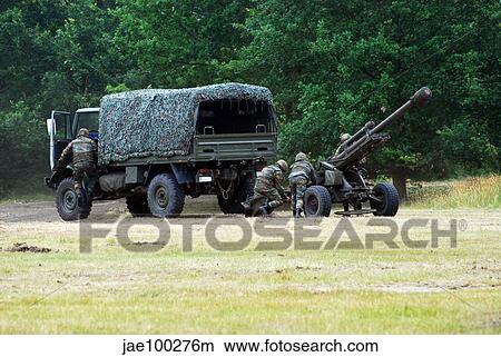 A Belgian artillery unit setting up the LG1 105 mm/30-calibre towed howitzer. View Large Photo Image Picture - A Belgian artillery unit setting up the LG1 105 mm/30-calibre towed howitzer.. Fotosearch
