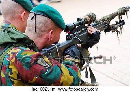 A Belgian paratrooper handling a sniper rifle. View Large Photo Image Picture - A Belgian paratrooper handling a sniper rifle.. Fotosearch