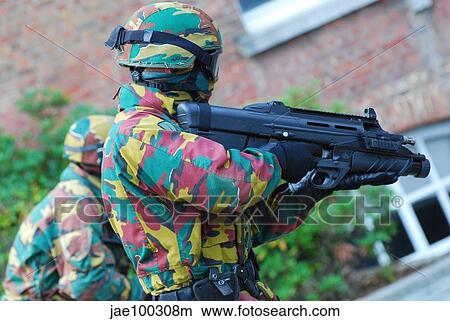 Picture - A Belgian paratrooper handling the FN F2000 assault rifle.. Fotosearch