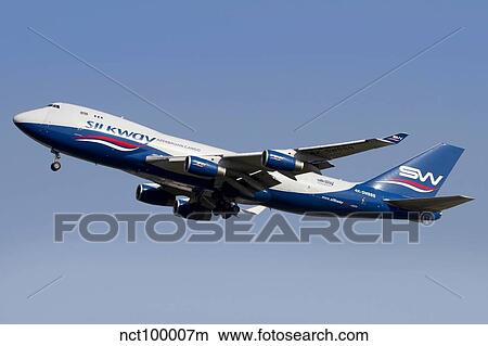 A Boeing 747-400 of Slik Way Airlines in flight over Italy. View Large Photo Image Picture - A Boeing 747-400 of Slik Way Airlines in flight over Italy.. Fotosearch