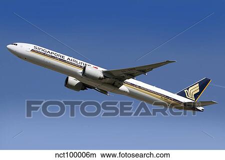 Picture - A Boeing 777 of Singapore Airlines in flight over Italy.. Fotosearch