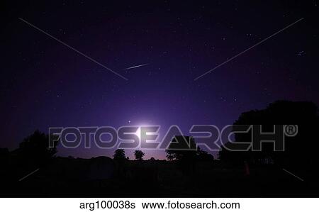 A bolide from the Geminids meteor shower above a setting moon in Mercedes, Argentina. View Large Photo Image Stock Photograph - A bolide from the Geminids meteor shower above a setting moon in Mercedes, Argentina.. Fotosearch