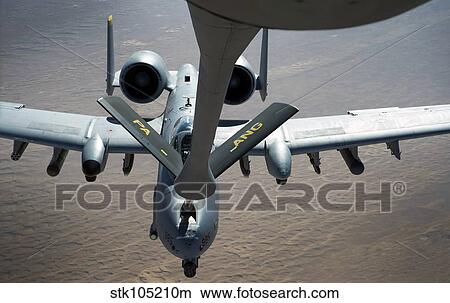 A boom operator refuels an A-10 Thunderbolt II. View Large Photo Image Picture - A boom operator refuels an A-10 Thunderbolt II.. Fotosearch