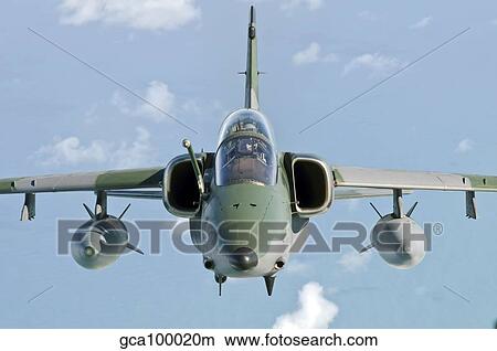 Picture - A Brazilian Air Force Embraer A-1B soars through the sky over Brazil.. Fotosearch