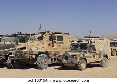A British Armed Forces Snatch Land Rover parked next to other military vehicles. View Large Photo Image Picture - A British Armed Forces Snatch Land Rover parked next to other military vehicles.. Fotosearch