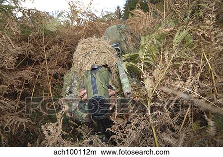 A British Army sniper team dressed in ghillie suits. View Large Photo Image Picture - A British Army sniper team dressed in ghillie suits.. Fotosearch