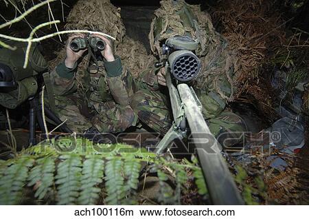 A British Army sniper team dressed in ghillie suits. View Large Photo Image Picture - A British Army sniper team dressed in ghillie suits.. Fotosearch