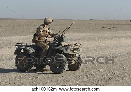 A British Army soldier provides security on a ATV. View Large Photo Image Picture - A British Army soldier provides security on a ATV.. Fotosearch