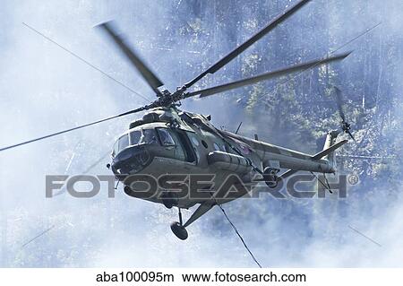 A Bulgarian Air Force Mi-17 helicopter over a forest fire in Bulgaria. View Large Photo Image Picture - A Bulgarian Air Force Mi-17 helicopter over a forest fire in Bulgaria.. Fotosearch