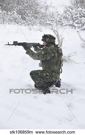 A Bulgarian soldier aims down the sight of an AK-47 rifle. View Large Photo Image Picture - A Bulgarian soldier aims down the sight of an AK-47 rifle.. Fotosearch