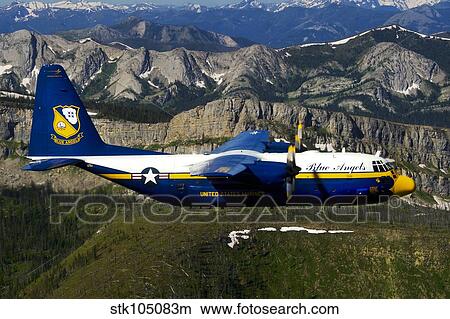 A C-130 Hercules Fat Albert plane flies over the Chinese Wall rock formation in Montana. View Large Photo Image Picture - A C-130 Hercules Fat Albert plane flies over the Chinese Wall rock formation in Montana.. Fotosearch