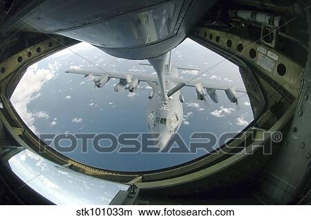 A C-130 Hercules is refueled by a KC-135 Stratotanker. View Large Photo Image Picture - A C-130 Hercules is refueled by a KC-135 Stratotanker.. Fotosearch