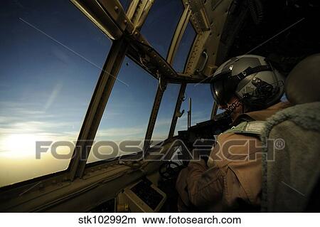 A C-130 Hercules pilot scans the horizon. View Large Photo Image Picture - A C-130 Hercules pilot scans the horizon.. Fotosearch