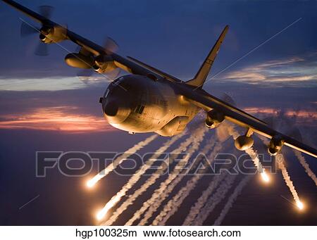 A C-130 Hercules releases flares during a mission over Kansas. View Large Photo Image Picture - A C-130 Hercules releases flares during a mission over Kansas.. Fotosearch