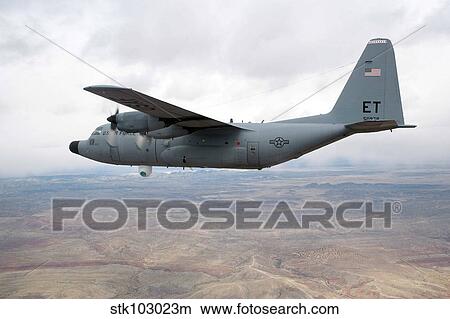 Picture - A C-130 Hercules soars through the sky.. Fotosearch