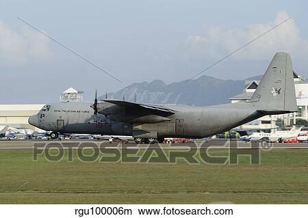 A C-130J Hercules of the Royal Malaysian Air Force prepares to take off. View Large Photo Image Picture - A C-130J Hercules of the Royal Malaysian Air Force prepares to take off.. Fotosearch