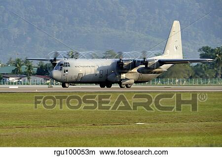 A C-130J Hercules of the Royal Malaysian Air Force prepares to take off. View Large Photo Image Picture - A C-130J Hercules of the Royal Malaysian Air Force prepares to take off.. Fotosearch