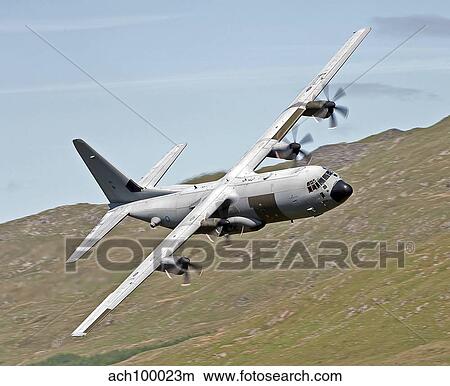 Picture - A C-130J Super Hercules low flying over North Wales on a training flight.. Fotosearch