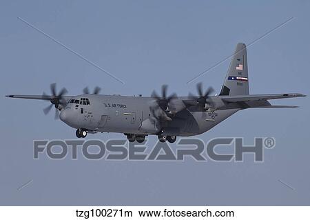 A C-130J Super Hercules of the 317th Airlift Group in flight over Germany. View Large Photo Image Picture - A C-130J Super Hercules of the 317th Airlift Group in flight over Germany.. Fotosearch