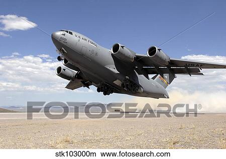 A C-17 Globemaster departs from the Tonopah runway. View Large Photo Image Picture - A C-17 Globemaster departs from the Tonopah runway.. Fotosearch