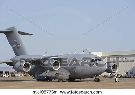 A C-17 Globemaster III parked on the ramp at an Air Force base. View Large Photo Image Picture - A C-17 Globemaster III parked on the ramp at an Air Force base.. Fotosearch