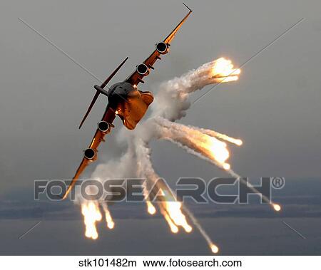 A C-17 Globemaster III releases flares over the Atlantic Ocean. View Large Photo Image Picture - A C-17 Globemaster III releases flares over the Atlantic Ocean.. Fotosearch