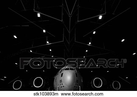 A C-17 Globemaster III sits in a hangar at McChord Field Air Force Base, Washington. View Large Photo Image Picture - A C-17 Globemaster III sits in a hangar at McChord Field Air Force Base, Washington.. Fotosearch