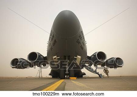 A C-17 Globemaster III sits on the runway at COB Speicher, Iraq. View Large Photo Image Picture - A C-17 Globemaster III sits on the runway at COB Speicher, Iraq.. Fotosearch