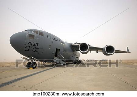 A C-17 Globemaster III sits on the runway at COB Speicher, Iraq. View Large Photo Image Picture - A C-17 Globemaster III sits on the runway at COB Speicher, Iraq.. Fotosearch