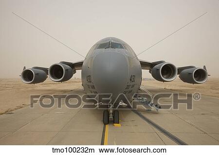 A C-17 Globemaster III sits on the runway at COB Speicher, Iraq. View Large Photo Image Picture - A C-17 Globemaster III sits on the runway at COB Speicher, Iraq.. Fotosearch