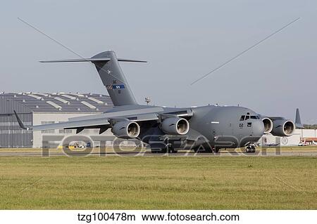 A C-17 Globemaster strategic transport aircraft taxiing on the runway. View Large Photo Image Picture - A C-17 Globemaster strategic transport aircraft taxiing on the runway.. Fotosearch
