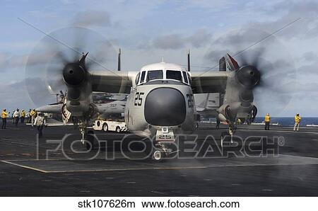 A C-2A Greyhound moves onto the flight deck of USS Nimitz. View Large Photo Image Picture - A C-2A Greyhound moves onto the flight deck of USS Nimitz.. Fotosearch
