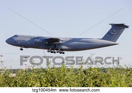 A C-5A Galaxy of the U. S. Air Force Reserve taking off. View Large Photo Image Picture - A C-5A Galaxy of the U. S. Air Force Reserve taking off.. Fotosearch