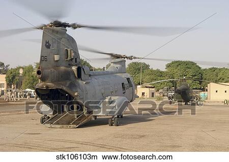 A CH-46 Sea Knight and Mi-8 helicopter at Al Kut, Iraq. View Large Photo Image Picture - A CH-46 Sea Knight and Mi-8 helicopter at Al Kut, Iraq.. Fotosearch