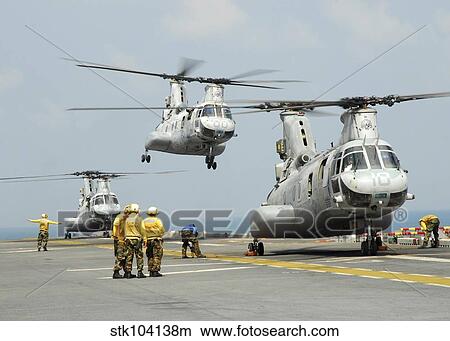 A CH-46E Sea Knight takes off from the flight deck of USS Essex. View Large Photo Image Picture - A CH-46E Sea Knight takes off from the flight deck of USS Essex.. Fotosearch
