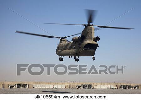 A CH-47 Chinook helicopter prepare to land. View Large Photo Image Picture - A CH-47 Chinook helicopter prepare to land.. Fotosearch
