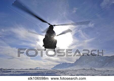 A CH-47 Chinook helicopter takes off from a remote landing zone. View Large Photo Image Picture - A CH-47 Chinook helicopter takes off from a remote landing zone.. Fotosearch