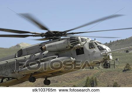 A CH-53 Super Stallion helicopter lands at the Mountain Warfare Training Center in California. View Large Photo Image Picture - A CH-53 Super Stallion helicopter lands at the Mountain Warfare Training Center in California.. Fotosearch
