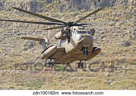 A CH-53 Yasur 2000 of the Israeli Air Force landing in the field. View Large Photo Image Picture - A CH-53 Yasur 2000 of the Israeli Air Force landing in the field.. Fotosearch
