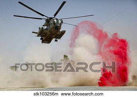 Picture - A CH-53D Sea Stallion helicopter landing to deliver supplies at Patrol Base Jaker, Afghanistan.. Fotosearch