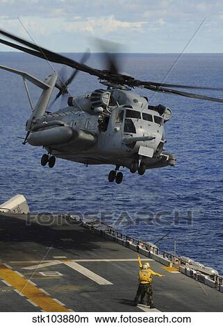 A CH-53E Sea Stallion helicopter takes off from amphibious assault ship USS Essex. View Large Photo Image Picture - A CH-53E Sea Stallion helicopter takes off from amphibious assault ship USS Essex. . Fotosearch