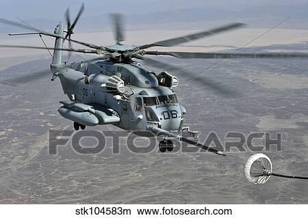 A CH-53E Super Stallion approaches a C-130P aircraft to refuel. View Large Photo Image Picture - A CH-53E Super Stallion approaches a C-130P aircraft to refuel.. Fotosearch