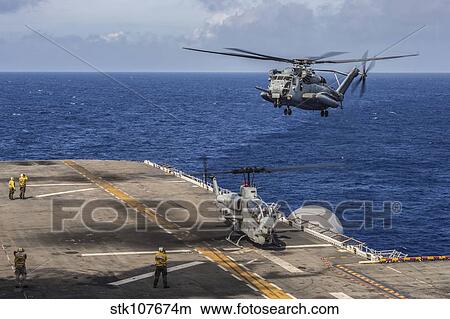 A CH-53E Super Stallion approaches USS Bonhomme Richard. View Large Photo Image Picture - A CH-53E Super Stallion approaches USS Bonhomme Richard.. Fotosearch