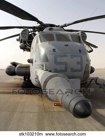 A CH-53E Super Stallion helicopter sitting on the flight line at Al Asad Air Base, Iraq. View Large Photo Image Picture - A CH-53E Super Stallion helicopter sitting on the flight line at Al Asad Air Base, Iraq. . Fotosearch