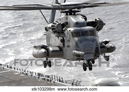 A CH-53E Super Stallion helicopter takes off from USS Makin Island. View Large Photo Image Picture - A CH-53E Super Stallion helicopter takes off from USS Makin Island.. Fotosearch