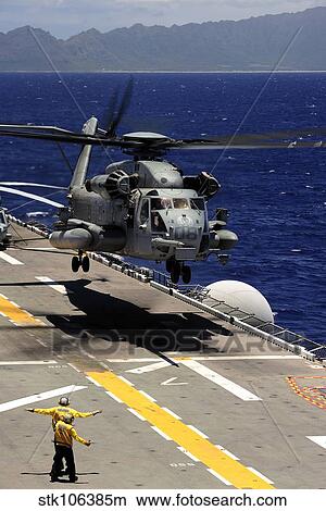A CH-53E Super Stallion helicopter practices landing aboard USS Essex. View Large Photo Image Picture - A CH-53E Super Stallion helicopter practices landing aboard USS Essex.. Fotosearch