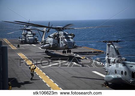 A CH-53E Super Stallion helicopter lifts off from USS Peleliu. View Large Photo Image Picture - A CH-53E Super Stallion helicopter lifts off from USS Peleliu.. Fotosearch
